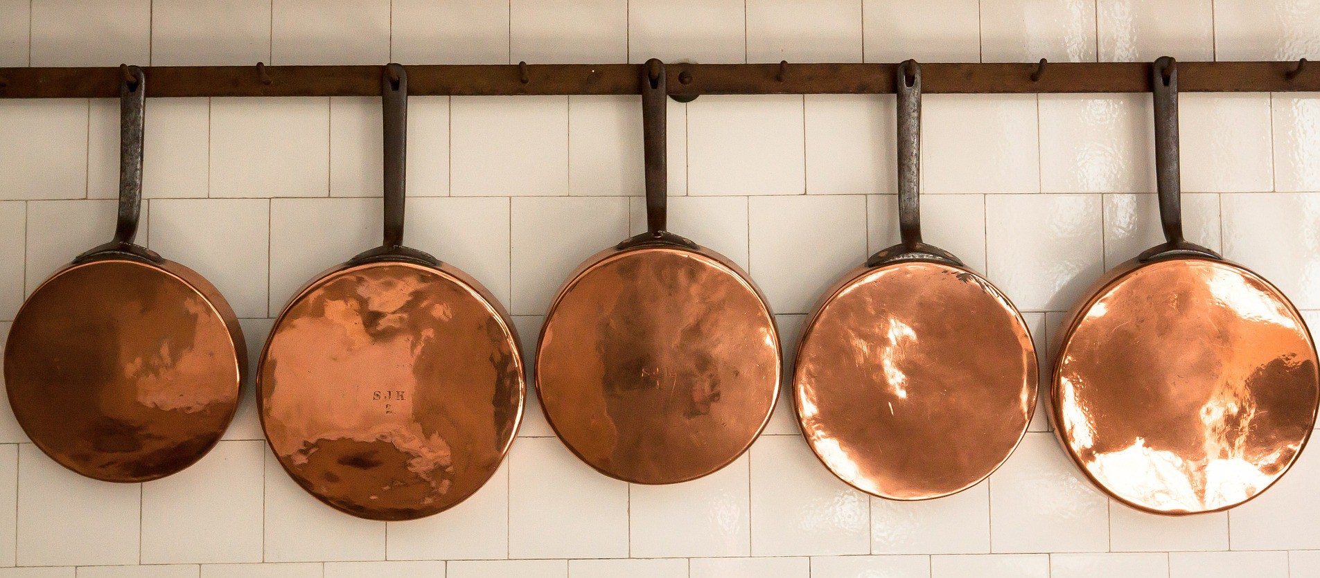 Pots and Pans neatly line the kitchen shelves