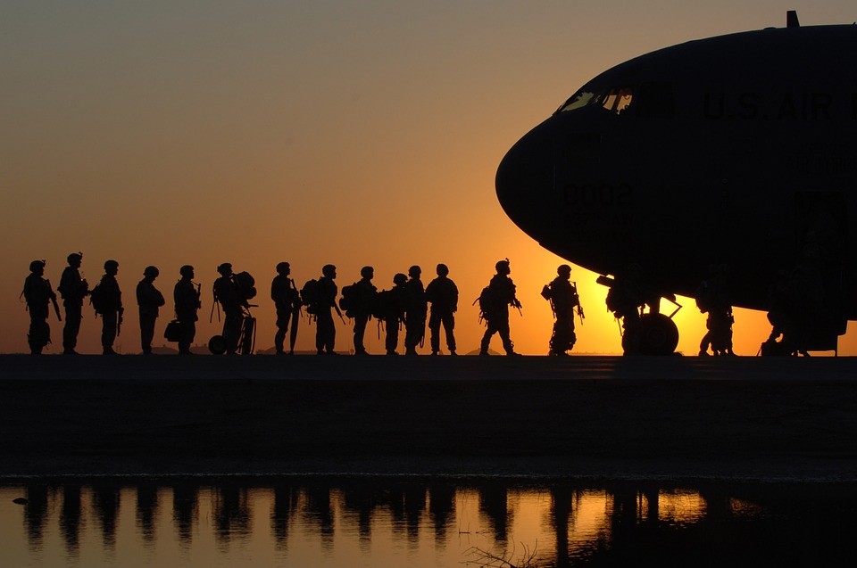 Military members entering a military aircraft
