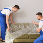 two movers assembling furniture