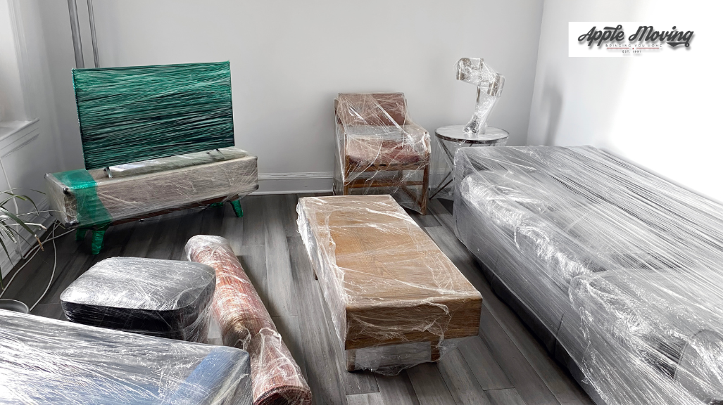 furniture and appliance covered in clear plastic wrappers